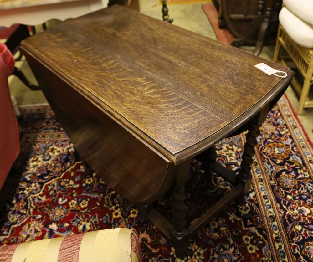A 1920s oak twist leg gateleg table, width 102cm, depth 54cm, height 72cm